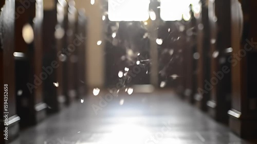 Church interior, with dark wooden pews, soft light and dust particles in the air