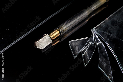 Wallpaper Mural A glass cutter lying on a broken glass Torontodigital.ca