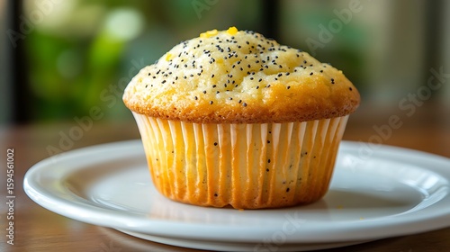 Freshly Baked Lemon Poppy Seed Muffin on a White Plate