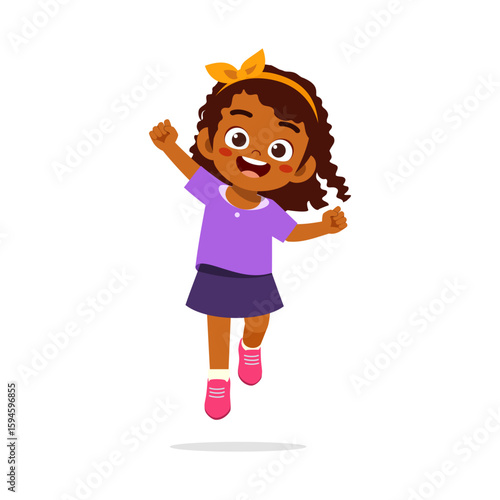 Happy African American girl with curly hair jumping with excitement in a joyful mood