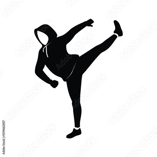 Dynamic silhouette of a dancer performing a powerful athletic move with grace