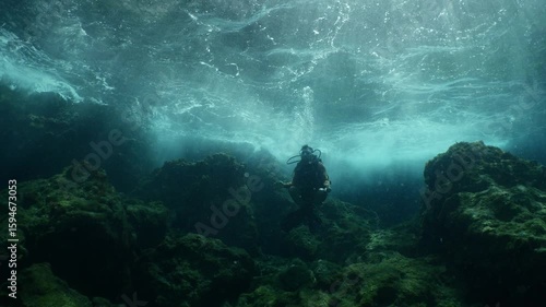 Wallpaper Mural scuba diver howers like budha underwater with waves under sun beams and rays yogo meditation Torontodigital.ca