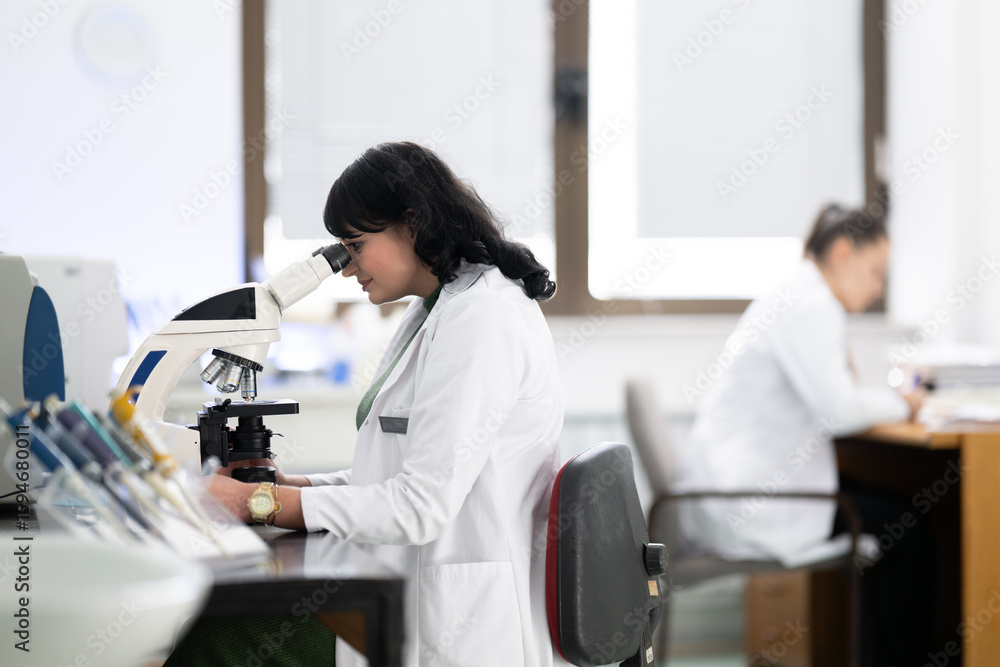 Fototapeta premium Doctor scientist using microscope in laboratory