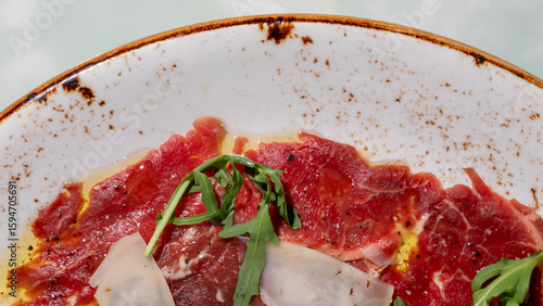 Canvas-taulu Sliced carpaccio glistens with olive oil, reminiscent of Italian Ferragosto feas