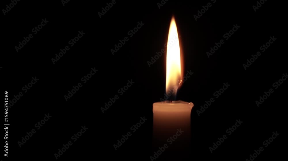 Close-Up of a Burning Candle Flame in the Dark Close-Up of a Burning Candle Flame in the Dark