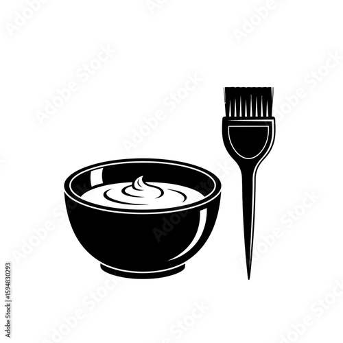 A bowl of hair dye with a brush, isolated on white background