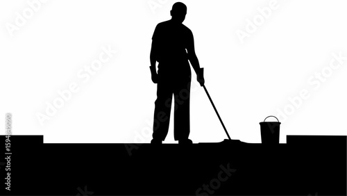 Silhouette of a person mopping the floor with a bucket nearby in a high contrast black and white image
