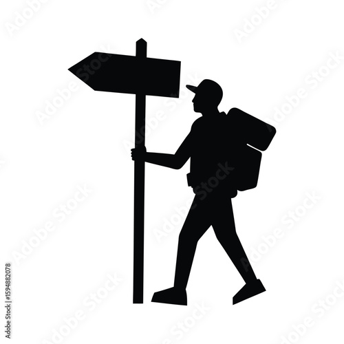 Hiker silhouette at a direction signpost