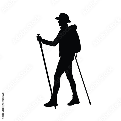 Silhouette of a hiker with trekking poles