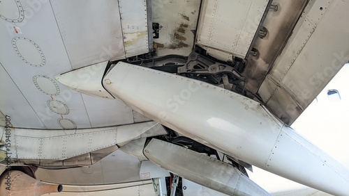 Fotografie Underside view of the aircraft wing with several flap track fairings