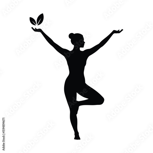 Silhouette of a woman in tree pose with leaves in her hands