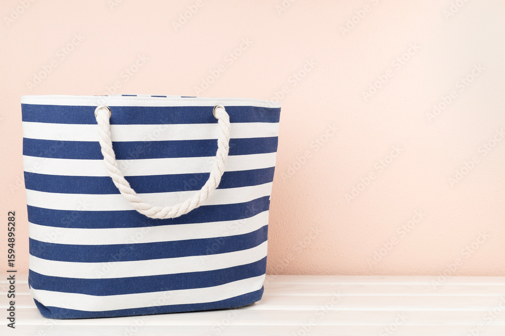 Fototapeta premium Blue beach bag on wooden table