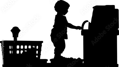 Silhouette of a toddler playing with a toy cash register next to a toy bin in an indoor setting