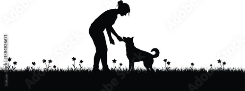 Silhouette of a woman bonding with her loyal dog in a vibrant flower field at sunset, symbolizing companionship and outdoor joy.