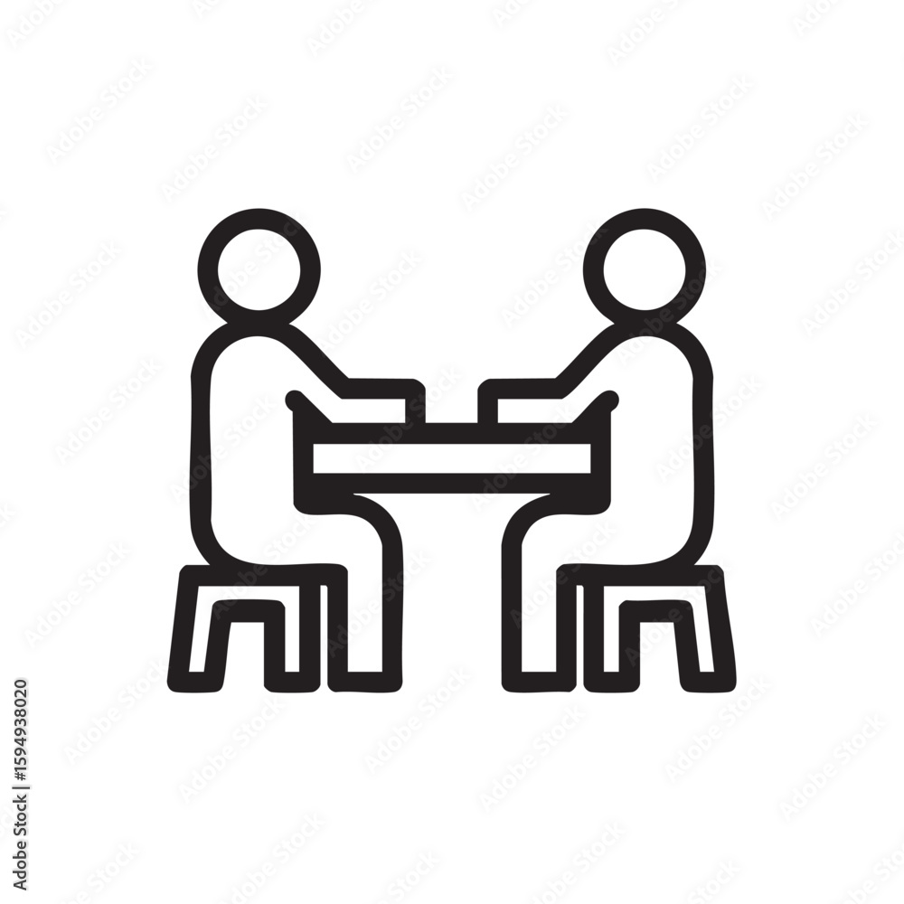 Fototapeta premium A simple black and white icon of two people sitting at a table.