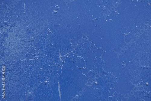 Photography A vibrant blue surface displays intricate variations in texture with subtle ridges and marks