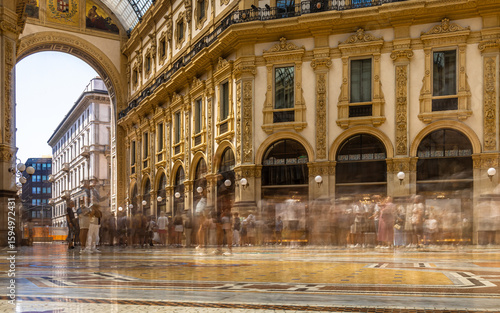 Wallpaper Mural Interior view of Galleria Vittorio Emanuele II in Milan with glass dome, ornate facades, and decorative fresco under bright daylight Torontodigital.ca