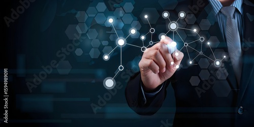 A businessmans hand draws a digital network connection on a futuristic interface