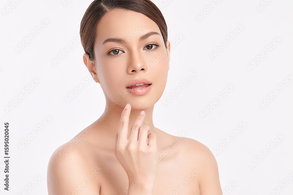 A beautiful young Asian woman with clean, fresh skin against a white background. Skincare, facial treatment, cosmetology, beauty, and spa. An elegant portrait of an Asian woman. A beautiful young Asian woman with clean, fresh skin against a white background. Skincare, facial treatment, cosmetology, beauty, and spa. An elegant portrait of an Asian woman.