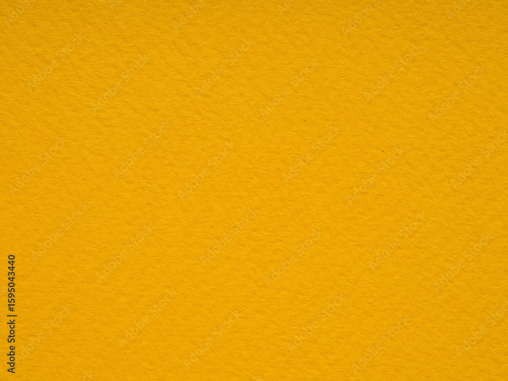 Obraz premium The rich textured hue of this yellow paper whispers tales of golden fields and warm, sunlit days