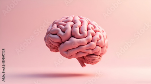 Human brain model floating on a soft pink background representing thought and mind concept