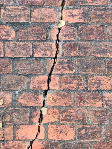 Crack in red brick wall