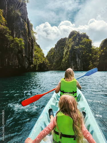 фотографія Family vacations - mom and kid kayaking travel in Philippines healthy lifestyle