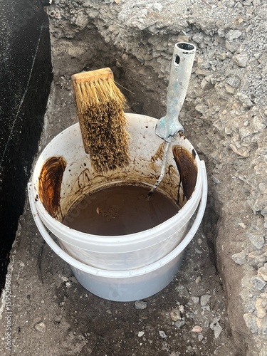 Billede på lærred External basement wall sealing with bitumen or sealing slurries, musty smell, hi
