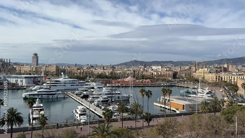 Panoramic View of Barcelona City with Port and Luxury Yachts on a Sunny Day

