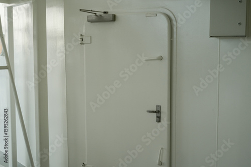 Wallpaper Mural modern industrial metal door in a brightly lit environment Torontodigital.ca