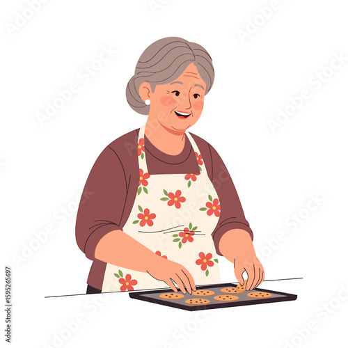 Smiling grandmother wearing an apron arranging cookies on a baking sheet.
