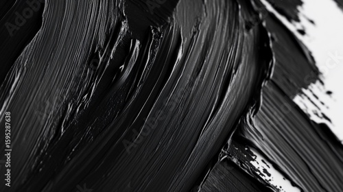 Abstract black and white brushstrokes with varying widths creating a textured surface