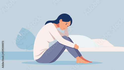 Young woman sitting on the floor in despair, showing symptoms of depression, anxiety and emotional struggle in a domestic setting