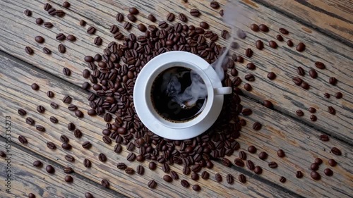 flat-lay composition of black coffee and coffee beans arranged neatly on surface