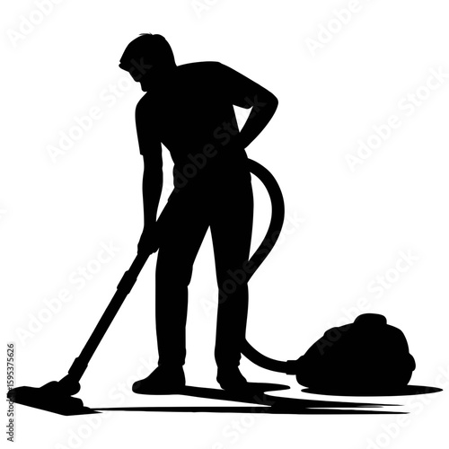 Silhouette of man vacuuming floor
