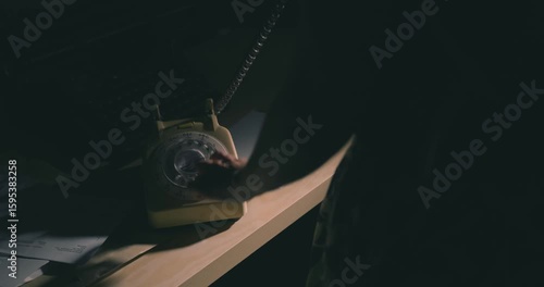 Making a call on an old rotary telephone