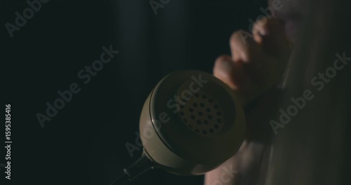 Making a call on an old rotary telephone