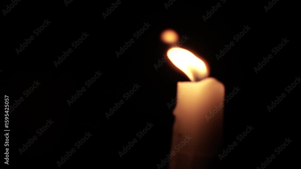 Close-Up of a Burning Candle Flame in the Dark Close-Up of a Burning Candle Flame in the Dark