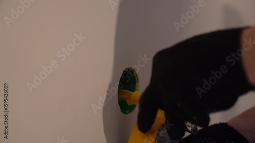 Insulation of wires with yellow electrical tape. Before painting the walls. Repair and preparation for electricity connection and installation of plastic outlets. High quality 4k footage