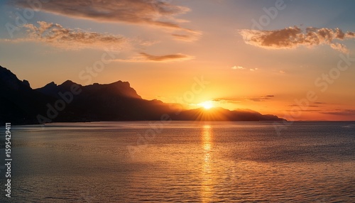 serene sunset over calm ocean waves with silhouetted mountains and gentle shoreline reflections capturing nature s tranquil beauty at dusk