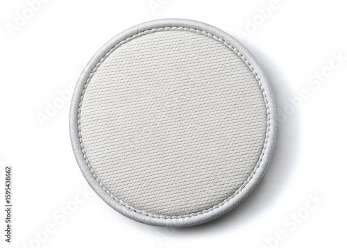 A round white fabric patch with stitched edges isolated on white