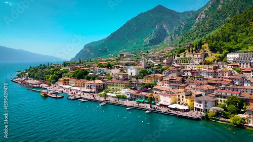 Charming Limone sul Garda sits on the edge of Lake Garda, surrounded by turquoise water and dramatic cliffs. Perfect for travel, real estate, and tourism-related commercial content