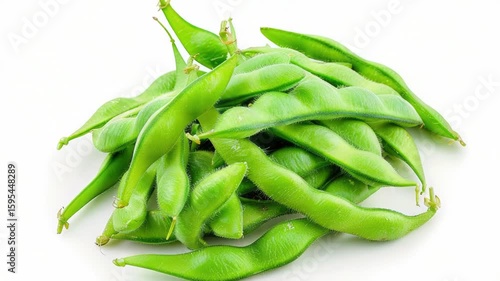 Fresh green beans arranged on a clean white surface