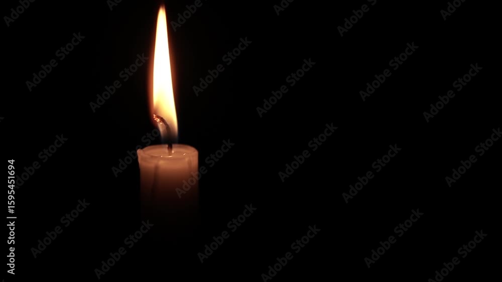 Close-Up of a Burning Candle Flame in the Dark Close-Up of a Burning Candle Flame in the Dark