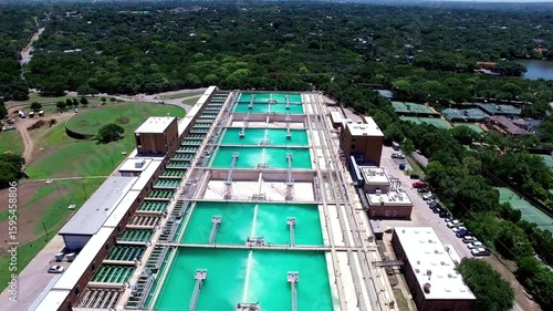 Aerial view of a water treatment plant in an urban area