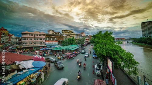 A bustling city street scene along the ping river in chiang mai