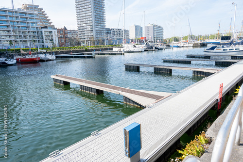 Harbor in Ostend, Belgium and ships, yachts, buildings, sea.
