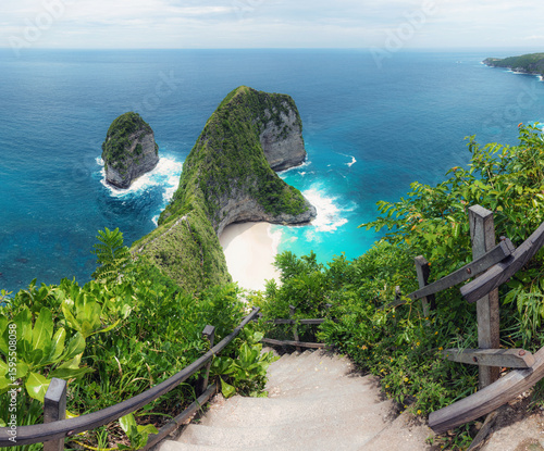 Turquoise ocean. Landscape of sunny day with  blue sky and mountains. View of Diamond beach, Nusa Penida, Bali island, Indonesia. Wallpaper background. Natural scenery. Romantic relax place.