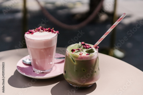 Rose Latte with teamed milk, rose
syrup, beetroot powder and dried rose petals and matcha latte. Aesthetic pink preppy style