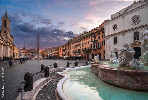 The beautiful Piazza Navona in Rome. Marble fountains and statues of Neptune.